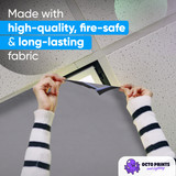 Teacher installing gray fabric light cover on classroom fluorescent fixture without tools