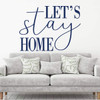Let's Stay Home wall art in cozy reading nook