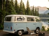 Camper and mountain scene decal with your family name, year and Adventure Awaits applied outdoors