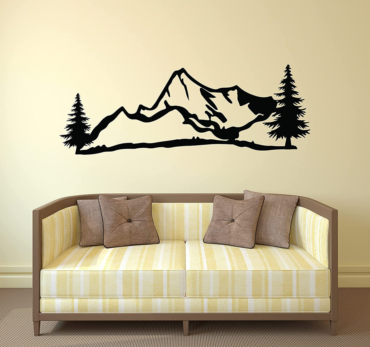 Mountain scene with pine trees vinyl wall decal above a sofa in a living room