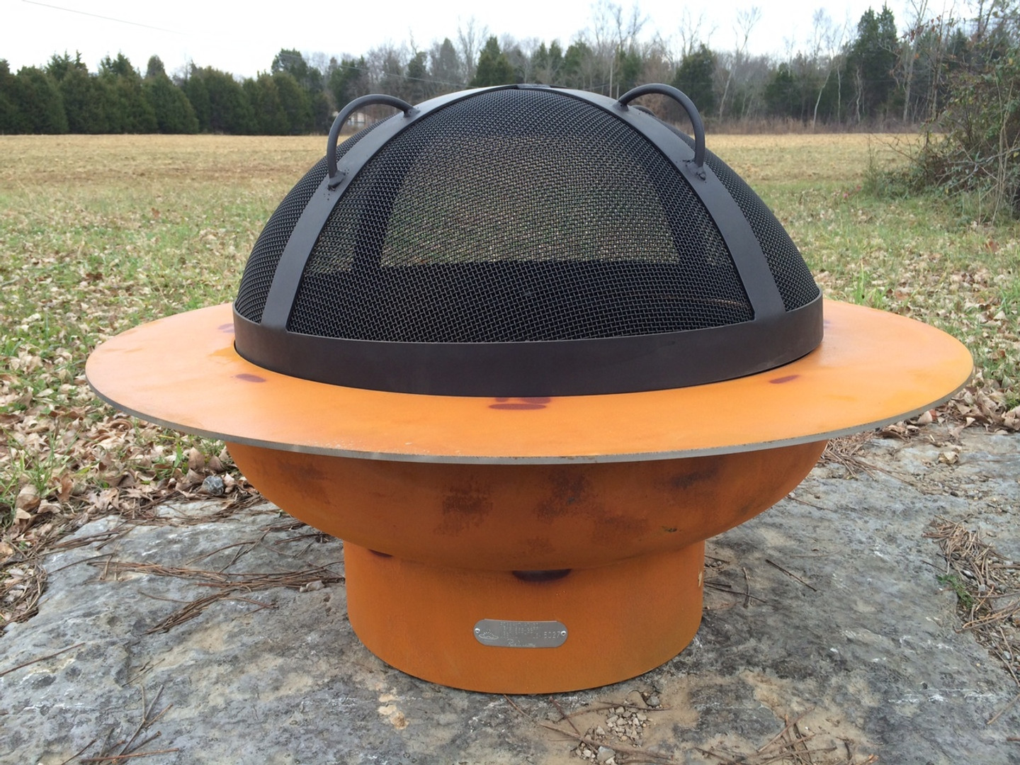 The SG-27.5" Artisan Spark Guard is handcrafted to rest on the tabs welded on the ID (inner diameter) of the Saturn bowl.  The SG-27.5 is designed to specifically fit Saturn and no other Fire Pit Art offering.