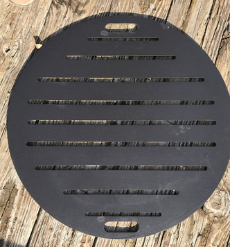 Fire pit grate created using 1/4" mild carbon steel painted black with two handles.  Not for cooking