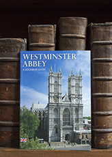 A guidebook of Westminster Abbey on a bookshelf