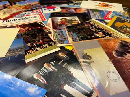 THREE COVER STORAGE BOXES PLUS MANY LOOSE COVERS AND MODERN POST CARDS - 900201