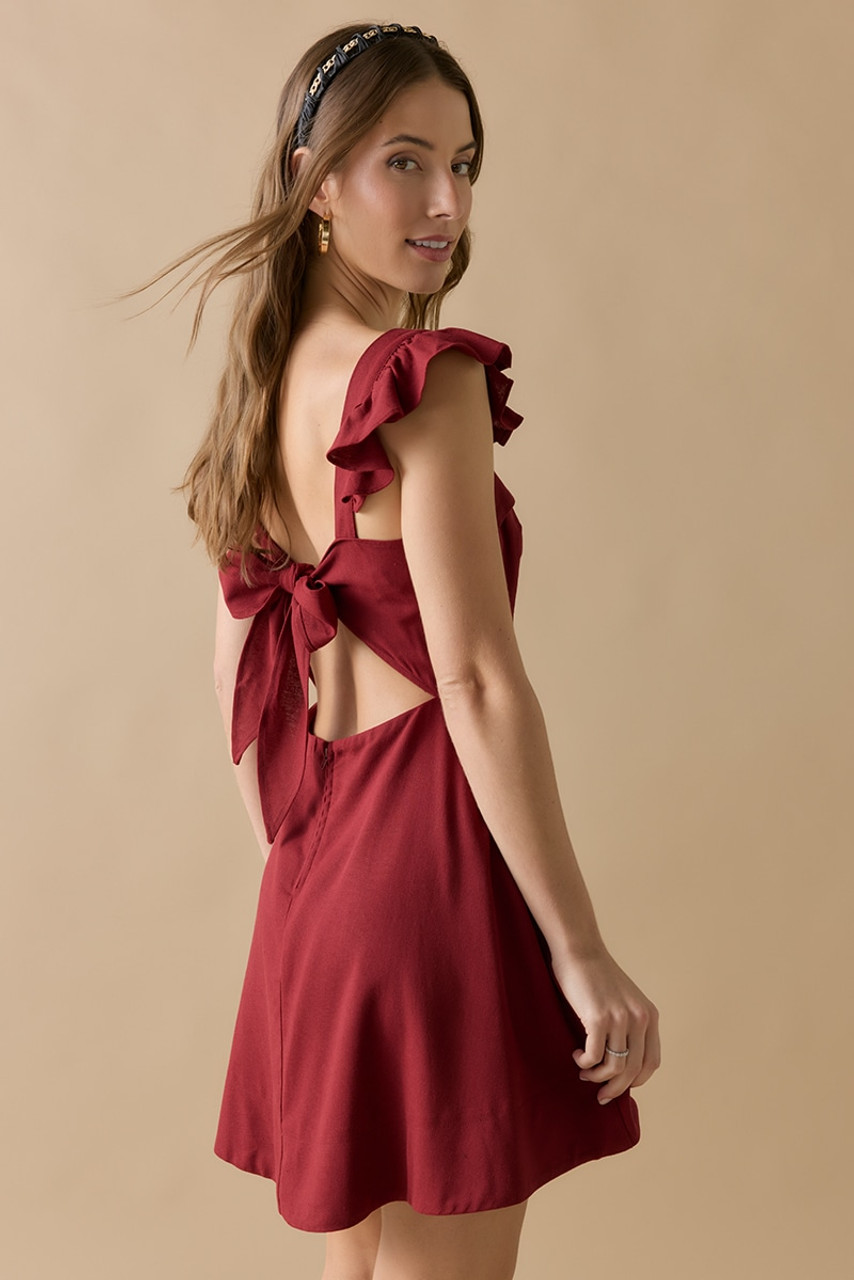 Cristina Bow Back Flutter Shoulder Mini Dress | francesca's® Cristina Bow Back Flutter Shoulder Mini Dress | francesca's®