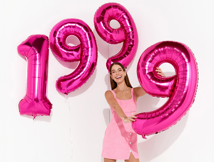 francesca's started as a single boutique in 1999, this image shows a girl holding balloons that show 1999.