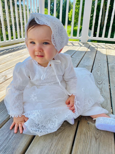 long sleeve christening dress Adeline Lace Gown at Baby Beau & Belle A 100% silk ribbon sash helps create a perfect fit Long Sleeve Christening Outfits Girl