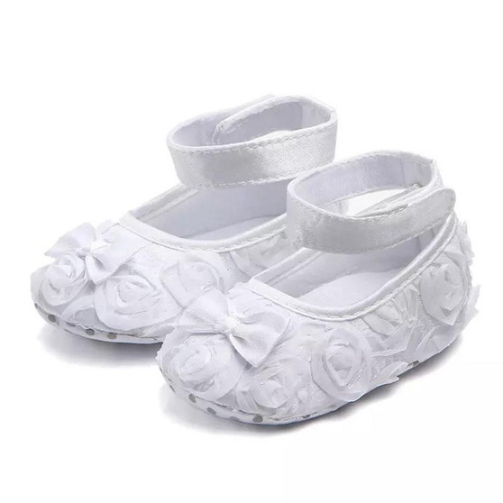 White rose baby shoes perfect for weddings, baptisms, and christenings.