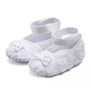 White rose baby shoes perfect for weddings, baptisms, and christenings.