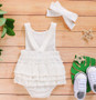 white baby romper and headband