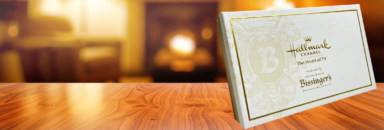 Embossed and debossed rigid carton with gold foil, showcasing premium custom packaging.