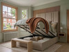 ​Valerius ottoman storage bed upholstered in premium beige velvet fabric, with the gas-lift base opened to reveal the spacious under-bed storage compartment.