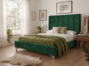 Constance Upholstered Bed Frame in rich green velvet fabric, featuring a tall statement headboard with deep-buttoned fluted panels