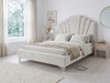Luxurious Evren Upholstered Bed Frame in cream velvet fabric, highlighting the 1920s glamour and bespoke stepped-up headboard design