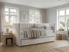 Noa Upholstered Daybed in cream velvet, featuring an elegant fluted backrest and plain padded arms