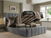 Grey velvet Martina Ottoman bed with the gas-lift base raised, revealing a spacious under-bed storage compartment with solid base boards.