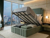 Mint velvet Ottoman storage bed open showing the gas-lift mechanism and spacious dust-free under-bed storage.