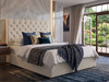 Side view of the Luisa ottoman bed in white Ivory Atlanta Soft Teddy, showing the deep diamond tufted headboard and low footboard