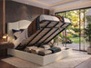 Bruno Ottoman Storage Bed in ivory cream Atlanta fabric with the base lifted, showing the internal under-bed storage compartment.