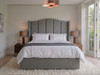 Jimena wingback ottoman storage bed in Steel Atlanta Soft Teddy, front view showing the curved headboard with deep vertical fluted channels