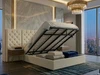 Cream boucle ottoman bed lifted open to reveal the spacious under-bed storage area and gas-lift mechanism