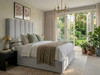 Bella Bubble ottoman bed in silver with a tall headboard of deep rounded vertical channels