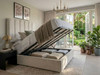 Bella Bubble ottoman bed in ivory with the gas-lift base raised to show the storage space underneath