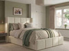Cream smooth velvet ottoman storage bed frame featuring a tall fluted wingback headboard.