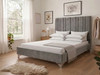 Mirta upholstered bed frame in modern grey velvet, featuring a tall headboard with deep vertical accent lines and a plain, low footboard.