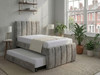 Sibel modern fluted bed frame upholstered in plush silver velvet fabric with integrated pull out trundle bed