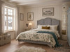 Grey linen upholstered bed frame.