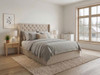 Elegant, classic bed frame upholstered in soft beige velvet fabric, featuring a deep buttoned headboard and matching frame.