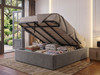 Nora ottoman bed base in steel grey Atlanta fabric with the gas-lift lid open, showing the deep storage area with huge capacity for bedding and blankets