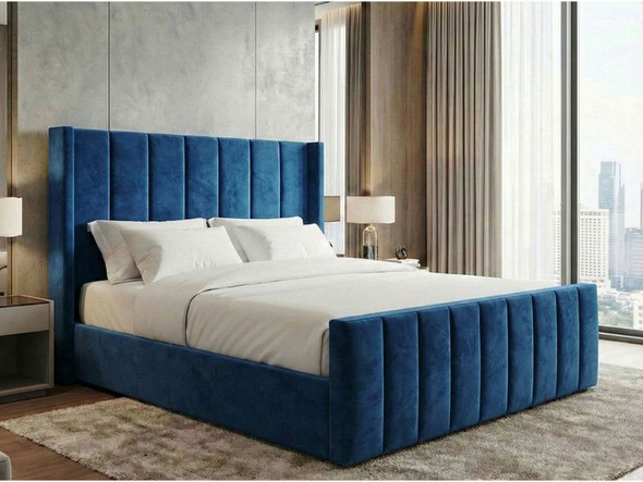 Felicia Blue Velvet Ottoman Storage Bed with tall winged headboard and vertical fluted detailing.