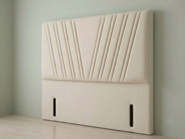 ​A chic headboard featuring cream-colored velvet fabric with vertical panel channeling, adding an elegant and clean-lined look to any bed.