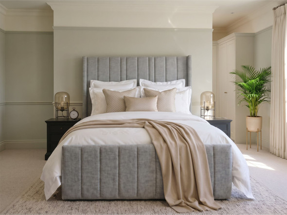 Main view of the Carla Wingback Ottoman Storage Bed in Steel Grey Atlanta fabric, featuring a deep fluted headboard and contrasting high footboard.