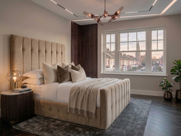 The Tarja Ottoman Storage Bed Frame tailored in warm beige velvet, featuring an imposing tall headboard with deep vertical flutes and bespoke tufting