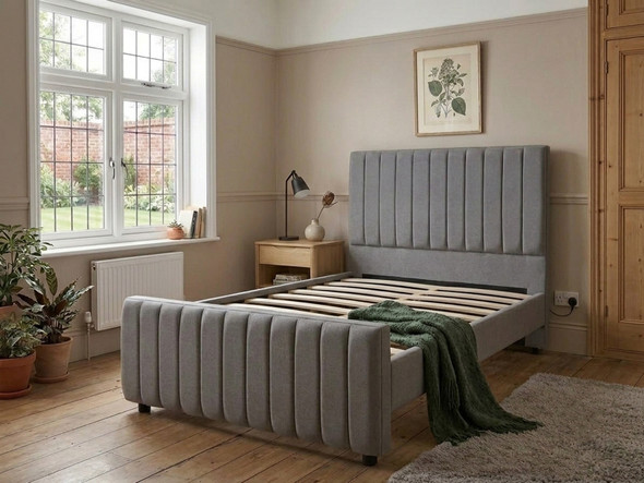 Grey linen upholstered bed frame without a mattress, displaying the solid wooden slats and central support bar.