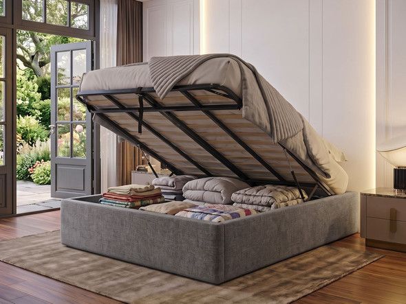 Nora ottoman bed base in steel grey Atlanta fabric with the gas-lift lid open, showing the deep storage area with huge capacity for bedding and blankets