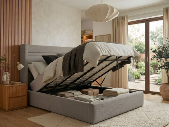 Linnea wingback ottoman bed in grey steel Atlanta fabric with the gas-lift base open, showing the large storage area underneath the mattress