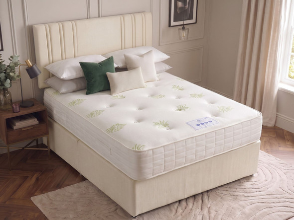 Ashford divan bed set in Ivory fabric seen from above, showing the tufted top and quilted border of the 1000 pocket sprung mattress