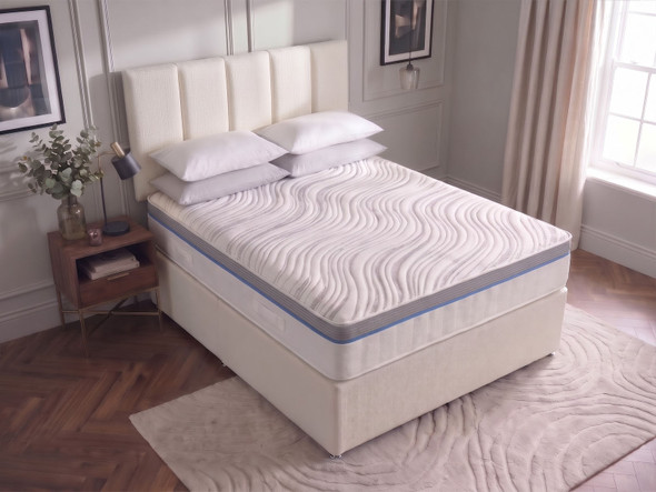 Hampton divan bed set in Ivory fabric seen from above, showing the wave quilted top and grey and blue border of the memory foam mattress