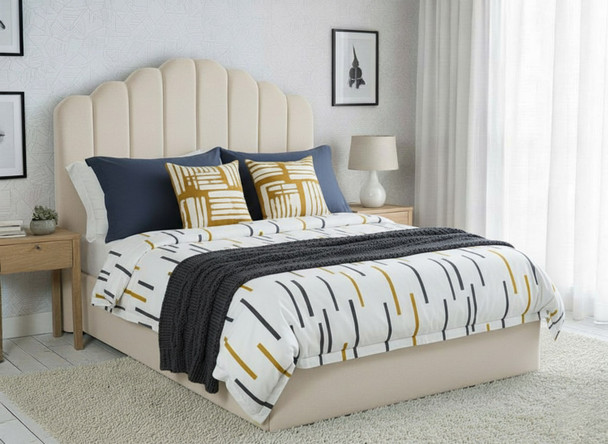 Discover the elegance of the Beau Ottoman Storage Bed, featuring a curved headboard with fluted accents and a low footboard for a stylish, functional bedroom.
