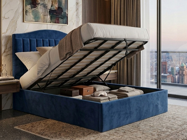 Rosalina Ottoman storage bed frame in blue velvet, lifted open to show the large internal storage area and solid base boards