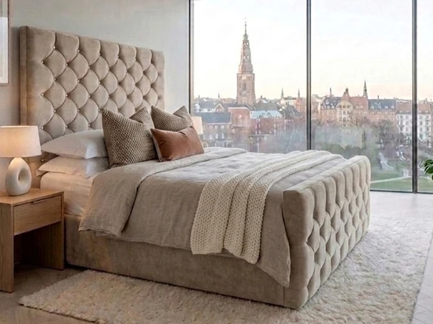 Full exterior view of the handcrafted Elena tufted Ottoman bed frame in soft beige fabric, highlighting the bespoke tall headboard and triple-reinforced frame