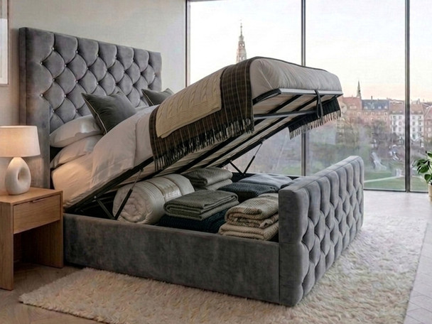 Grey fabric Elena Ottoman storage bed with the gas-lift mechanism open, revealing the spacious under-bed storage area, solid base boards, and heavy-duty steel frame