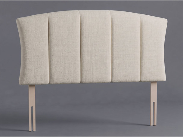 Harlow bed headboard in Ivory Atlanta fabric with an arched top, inward-curving sides, wide vertical panels and wooden fixing struts