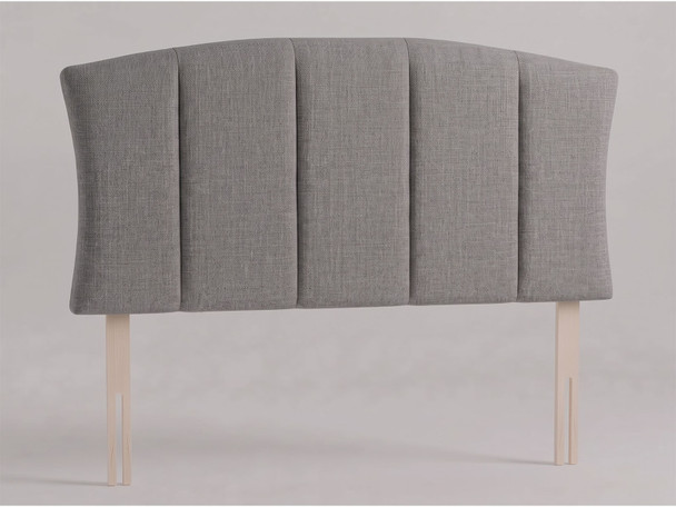 Harlow bed headboard in Steel Grey Atlanta fabric with an arched top, inward-curving sides, wide vertical panels and wooden fixing struts