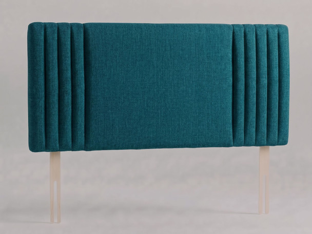 Brixton bed headboard in Teal Atlanta fabric with a smooth centre panel framed by slim vertical channels and wooden fixing struts
