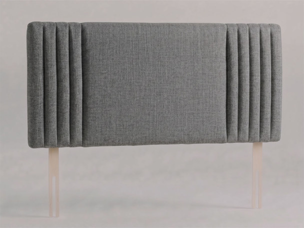 Brixton bed headboard in Steel Grey Atlanta fabric with a smooth centre panel framed by slim vertical channels and wooden fixing struts